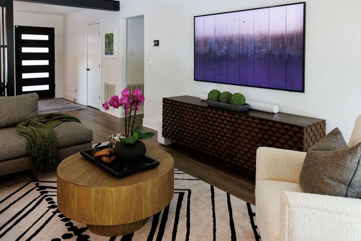 The living area of Michael Volk’s three bedroom, two bathroom single family home in San Antonio has a modern, open-concept feel.