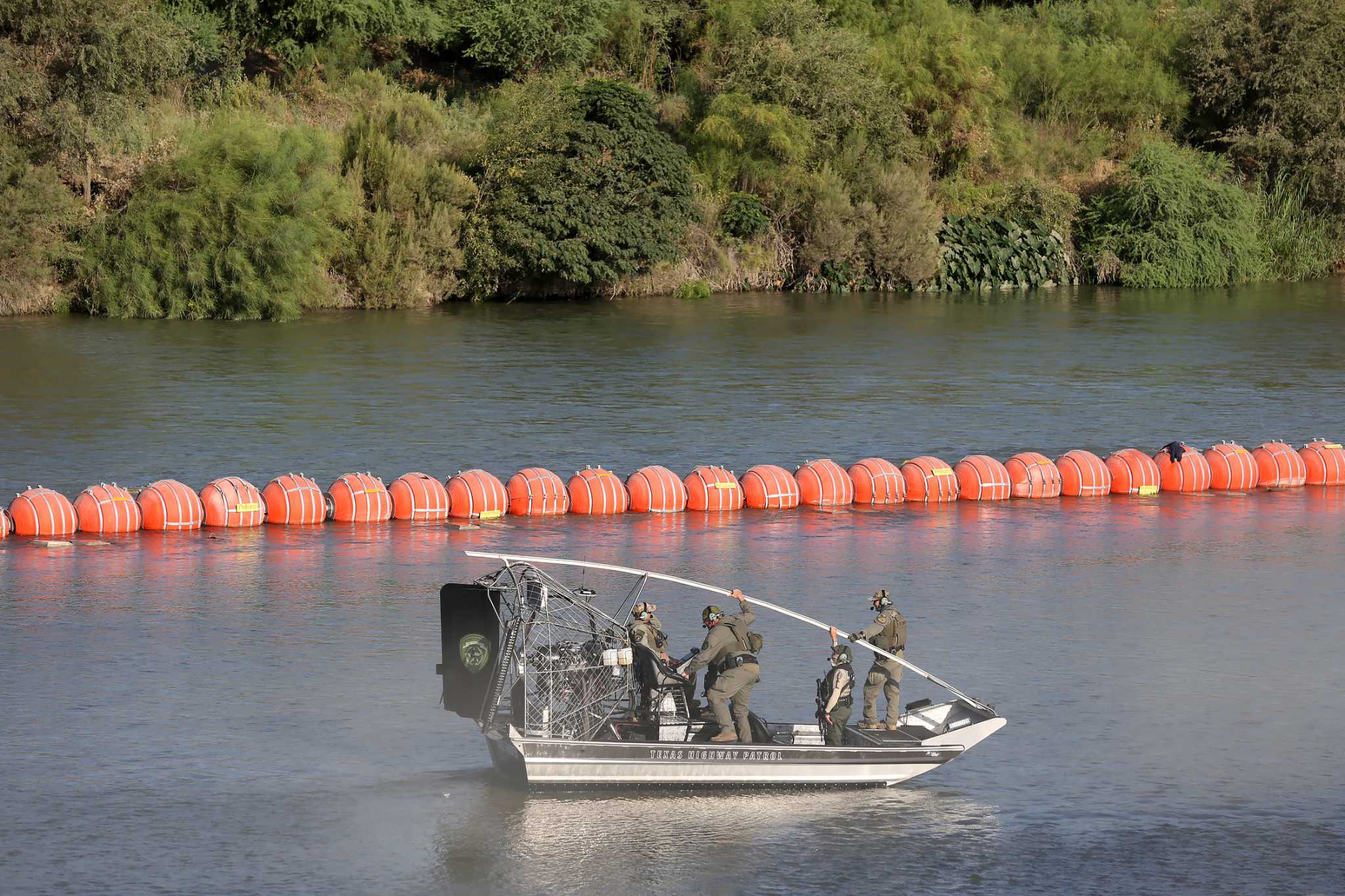 Justice Department tells Texas that floating barrier on Rio Grande