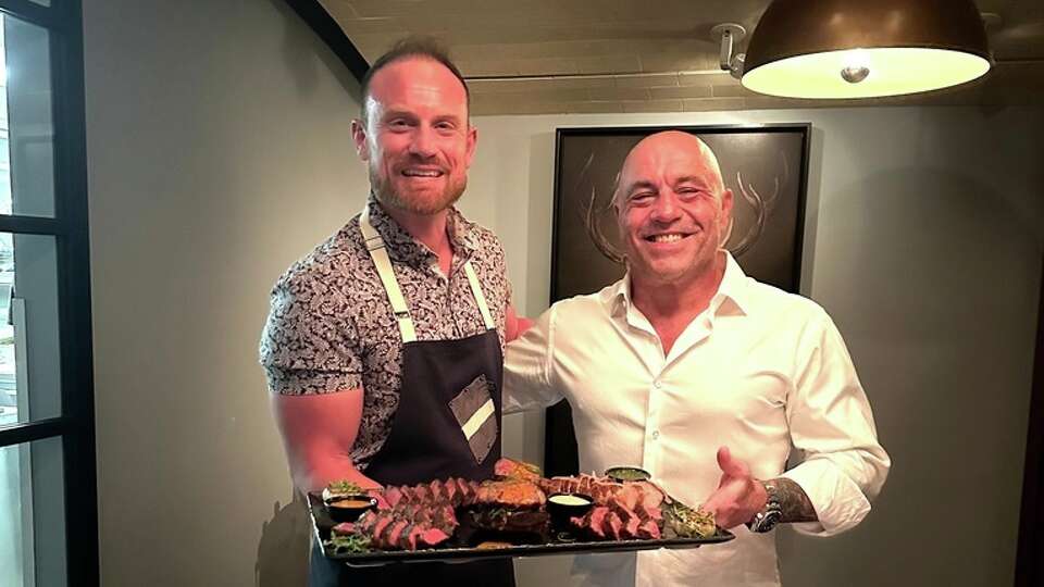 Tris executive chef Austin Simmons, left, with comedian Joe Rogan.