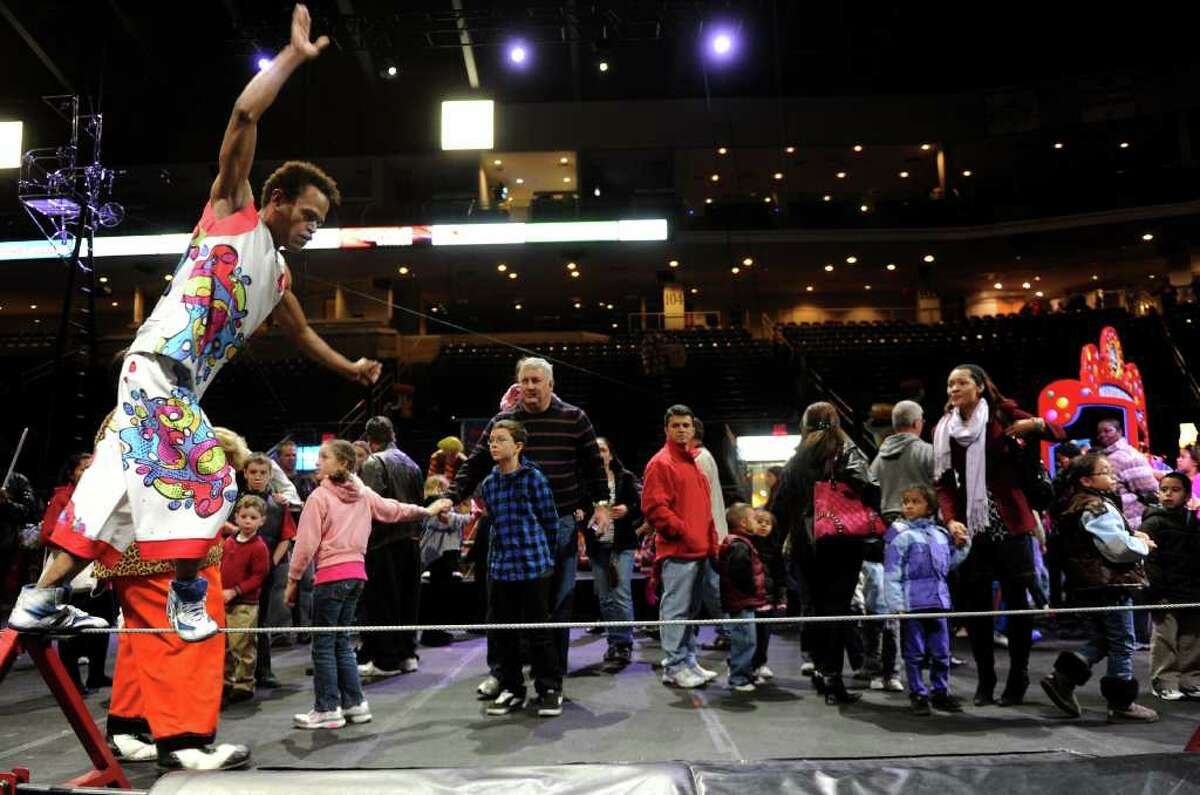 Visitors watch as a performer demonstrates tightrope-walking during the All Access Pre-Show to the Ringling Brothers and Barnum and Baily circus at the Arena at Harbor Yard on Thursday, October 21, 2010.