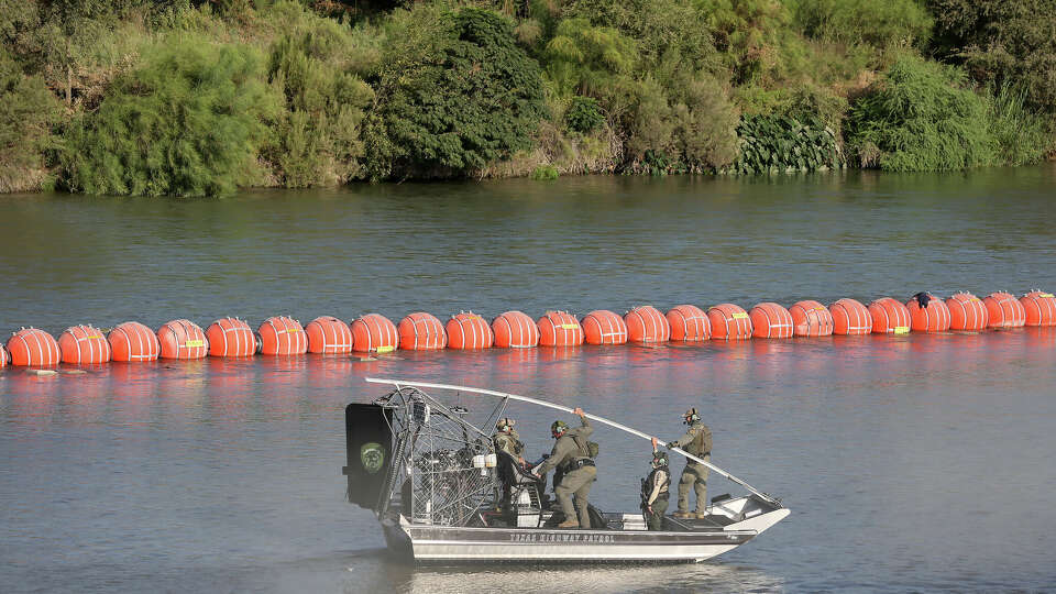 A Texas Department of Public Safety airboat crew guards a buoy system on the Rio Grande, Tuesday, Aug. 8, 2023. A Congressional delegation, led by Congressman Joaquin Castro, D-Texas, visited Eagle Pass, Texas to witness Texas Gov. Greg Abbott's Operation Lone Star.