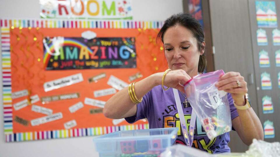 First grade teacher Kristi Garrison assembles activity bags for the upcoming school year at Eddie Ruth Lagway Elementary School, Thursday, Aug. 10, 2023 in Willis. The Willis ISD School Board approved a one-time payment of $1,500 for teachers and staff using Elementary and Secondary School Emergency Relief Funds, left over from the three federal stimulus bills during COVID-19 pandemic, in lieu of a raises in the district's 2023-2024 budget.