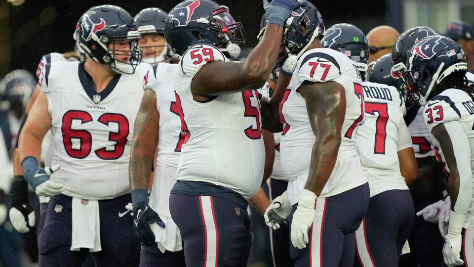 Houston Texans guard Kenyon Green (59) is seen during warmups along with offensive tackle George Fant (77) before a NFL pre-season game against the New England Patriots at Gillette Stadium, Thursday, Aug. 10, 2023 in Foxborough, Mass.