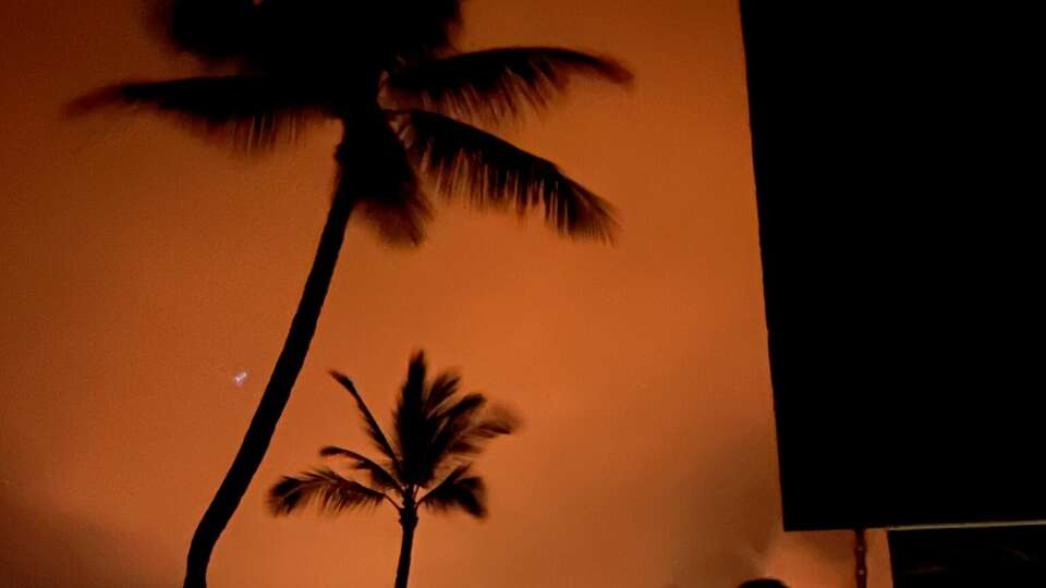 Chris Johnson and his wife Kayla wathced the Maui wildfires from a restaunt's patio after safetly navigating away from the bellowing smoke. 