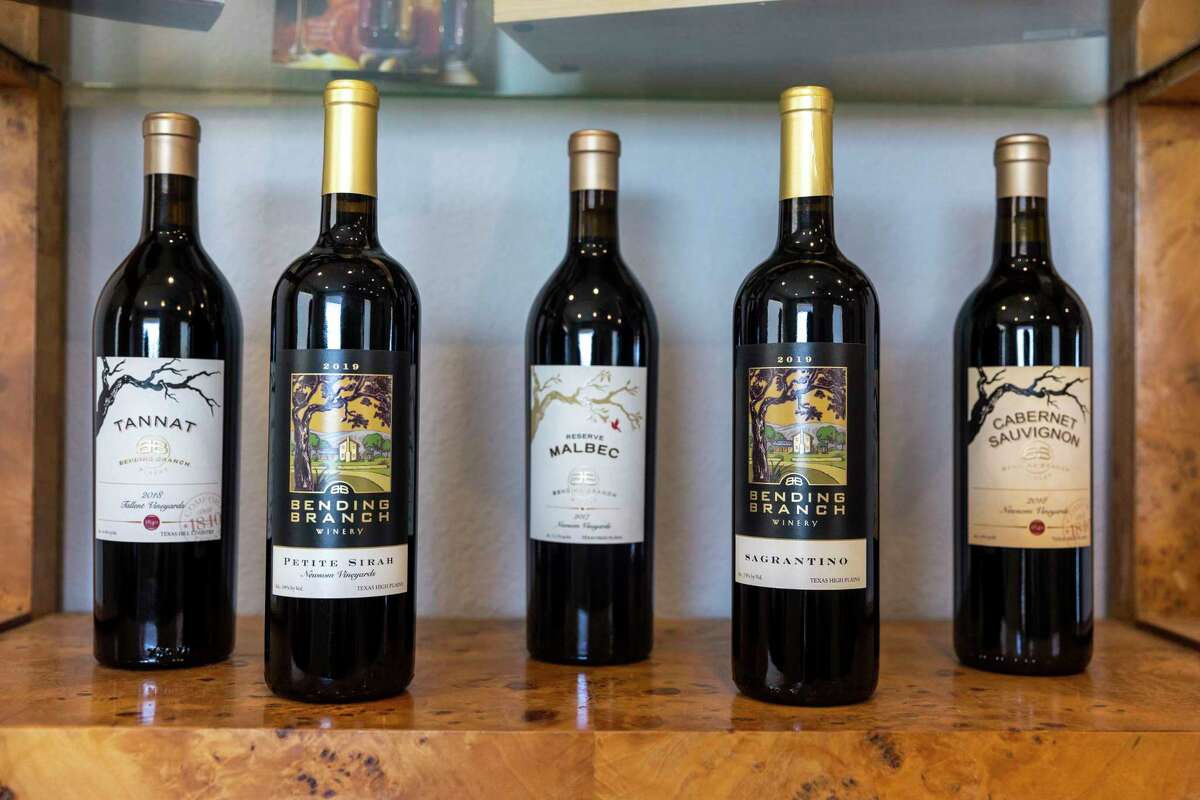 A selection of the wines made by Bending Branch Winery are displayed in the Wine Club Lounge at the winery in Comfort.