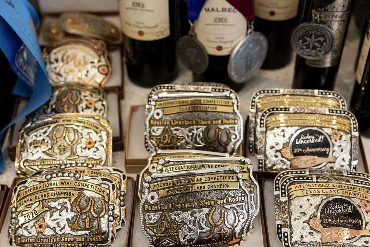Some of the numerous awards — in the form of belt buckles — earned by Bending Branch wines are displayed at the winery in Comfort.