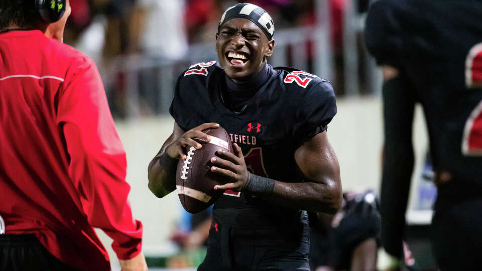 Westfield running back Taji Atkins (21) has a laugh with teammates after being pulled early in the second half of a high school football game against Cy-Park Friday, Aug 26, 2022, in Spring.