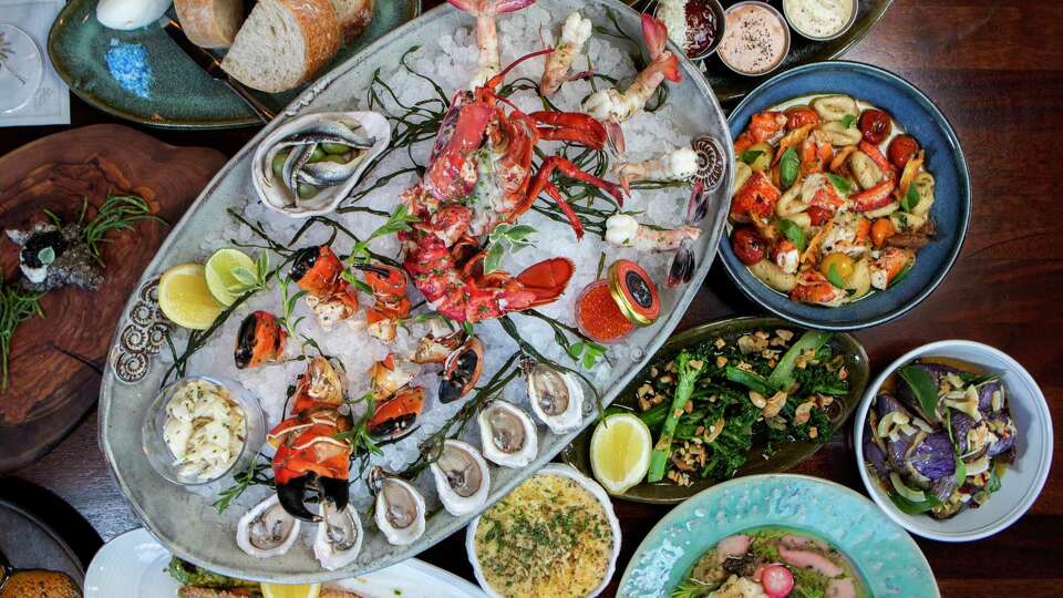 An assortment of seafood dishes and appetizers are seen at Little's Oyster Bar, Friday, Aug. 11, 2023, in Houston.