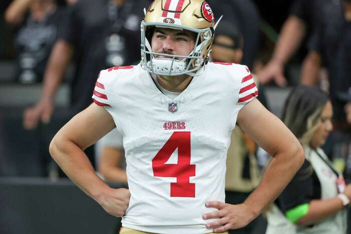 Trey Lance of the San Francisco 49ers passes against Malcolm