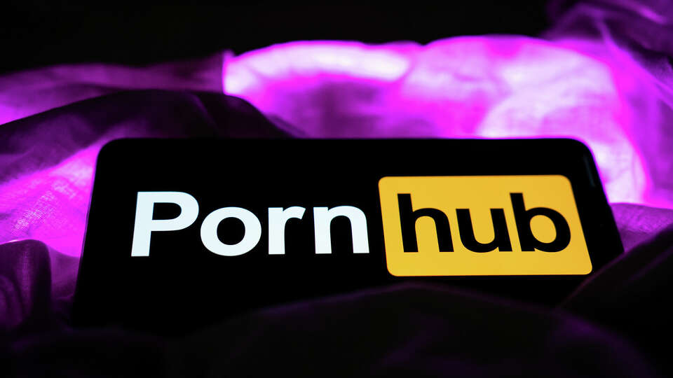 A mobile phone with the logo of Pornhub on its screen. (Photo by Nikos Pekiaridis/NurPhoto via Getty Images)