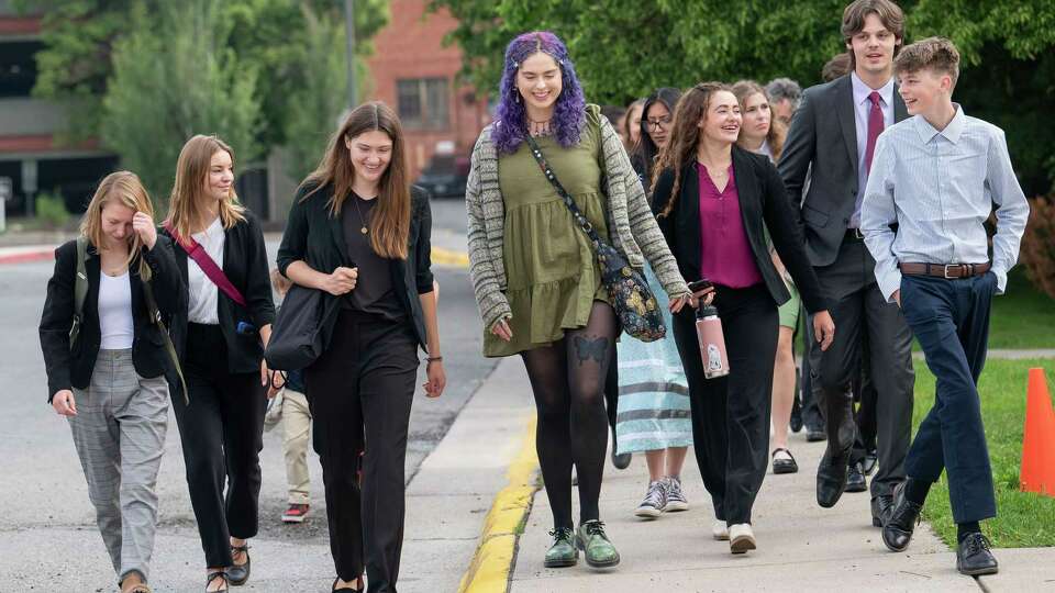 Youth plaintiffs and their attorneys in the the landmark Held vs Montana climate change lawsuit walk to the Lewis and Clark County Courthouse in Helena for the first day of their trial in June.