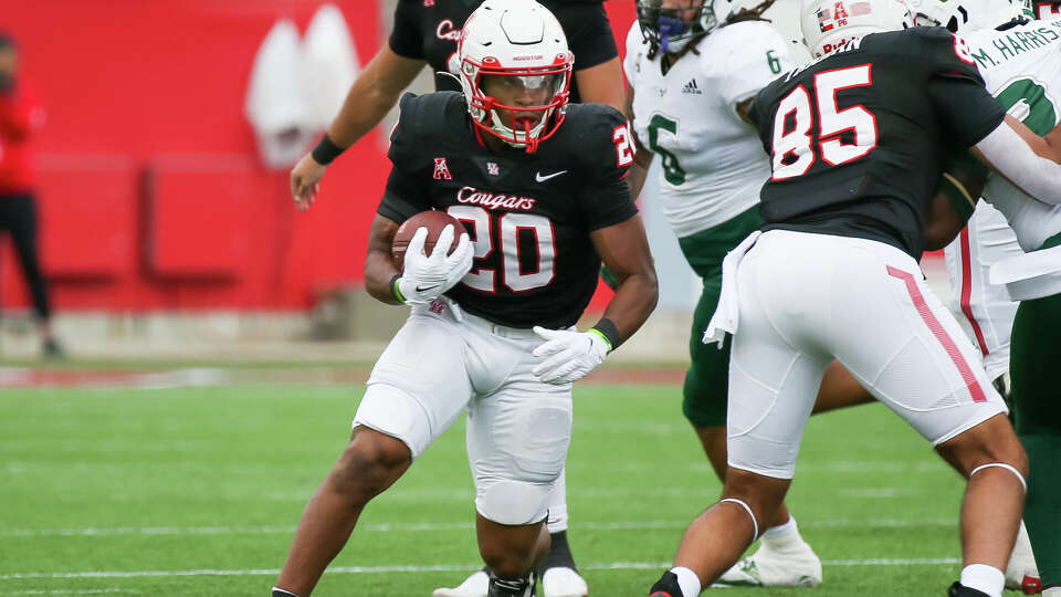 Houston Cougars running back Brandon Campbell carries the ball in the first quarter during the college football game between the South Florida Bulls and Houston Cougars at TDECU Stadium in Houston, Texas.