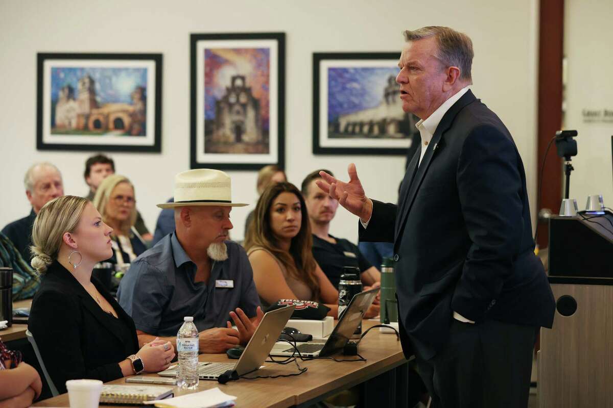 JB Goodwin, CEO of JB Goodwin Realtors, speaks to his realtors during a company meeting at their Sonterra Boulevard offices, Tuesday, Aug. 15, 2023.