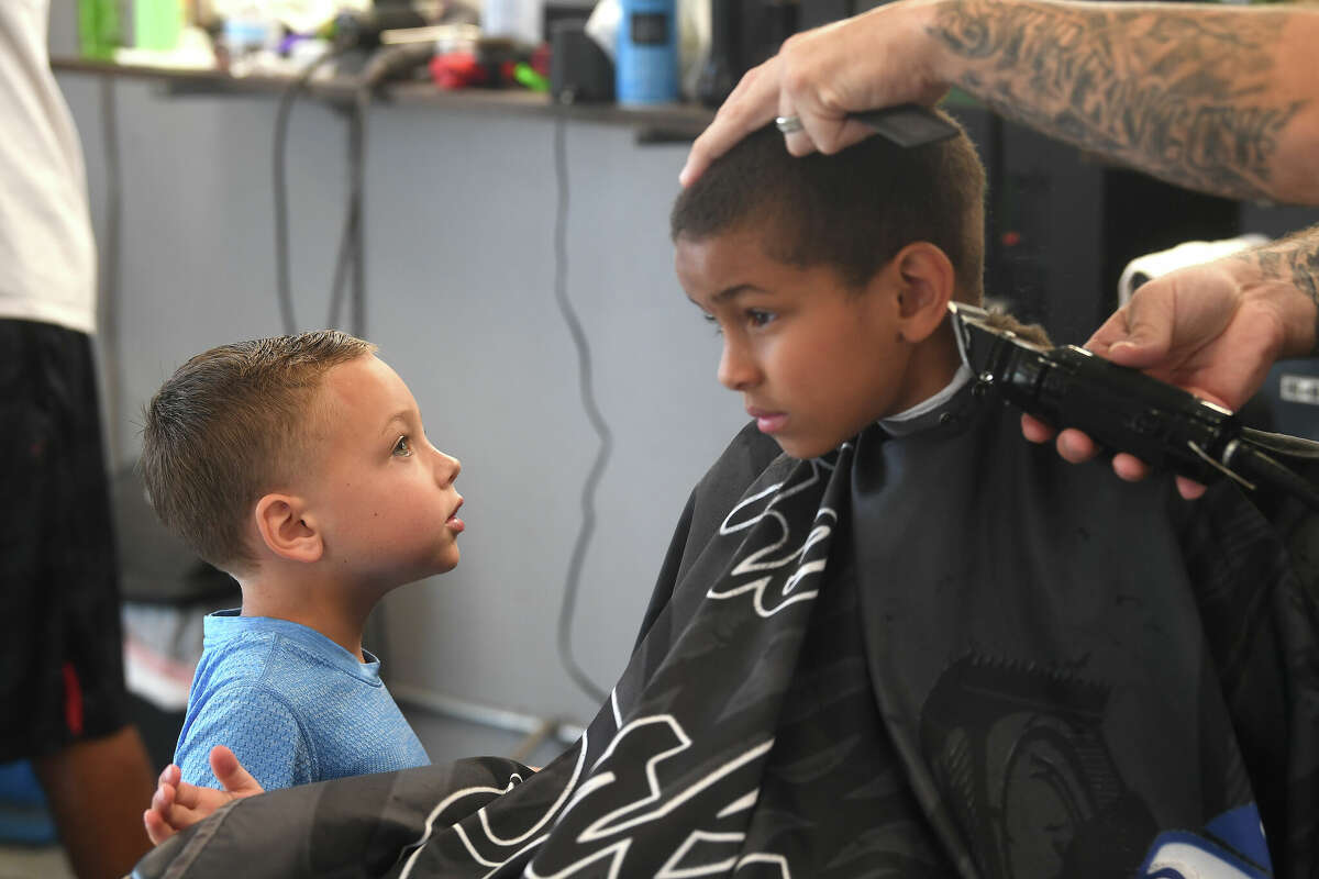 Port Arthur barber joins nonprofit for annual school haircuts event