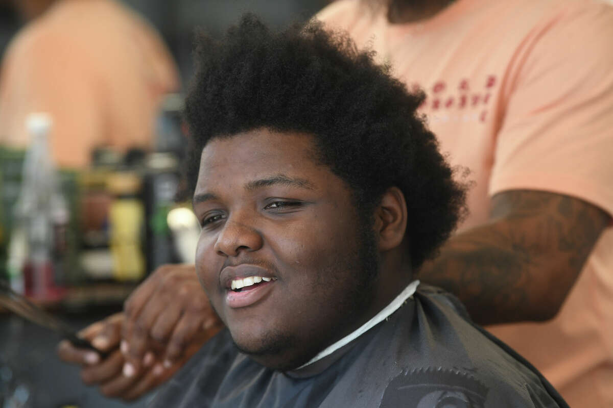 Port Arthur barber joins nonprofit for annual school haircuts event