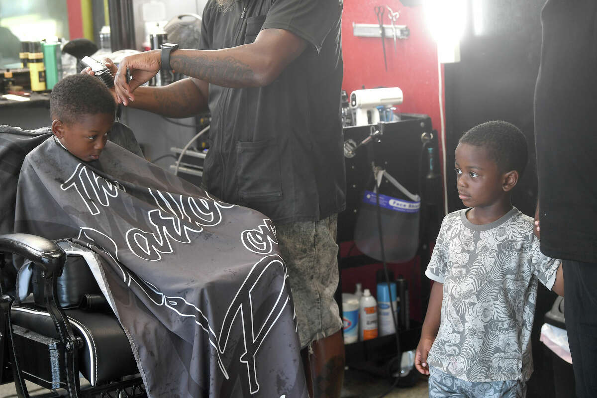 Port Arthur barber joins nonprofit for annual school haircuts event