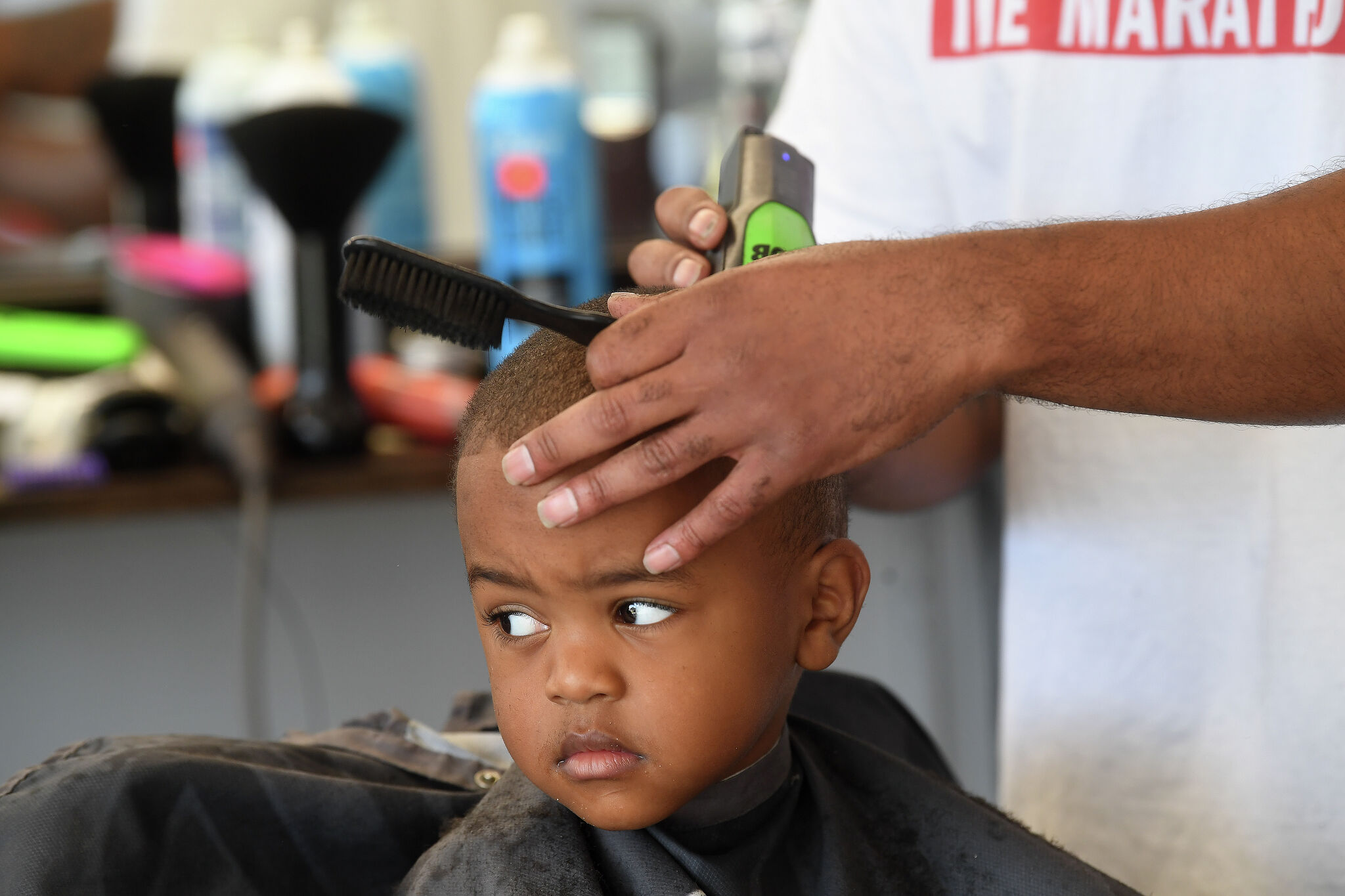 Port Arthur barber joins non profit for annual school haircuts event