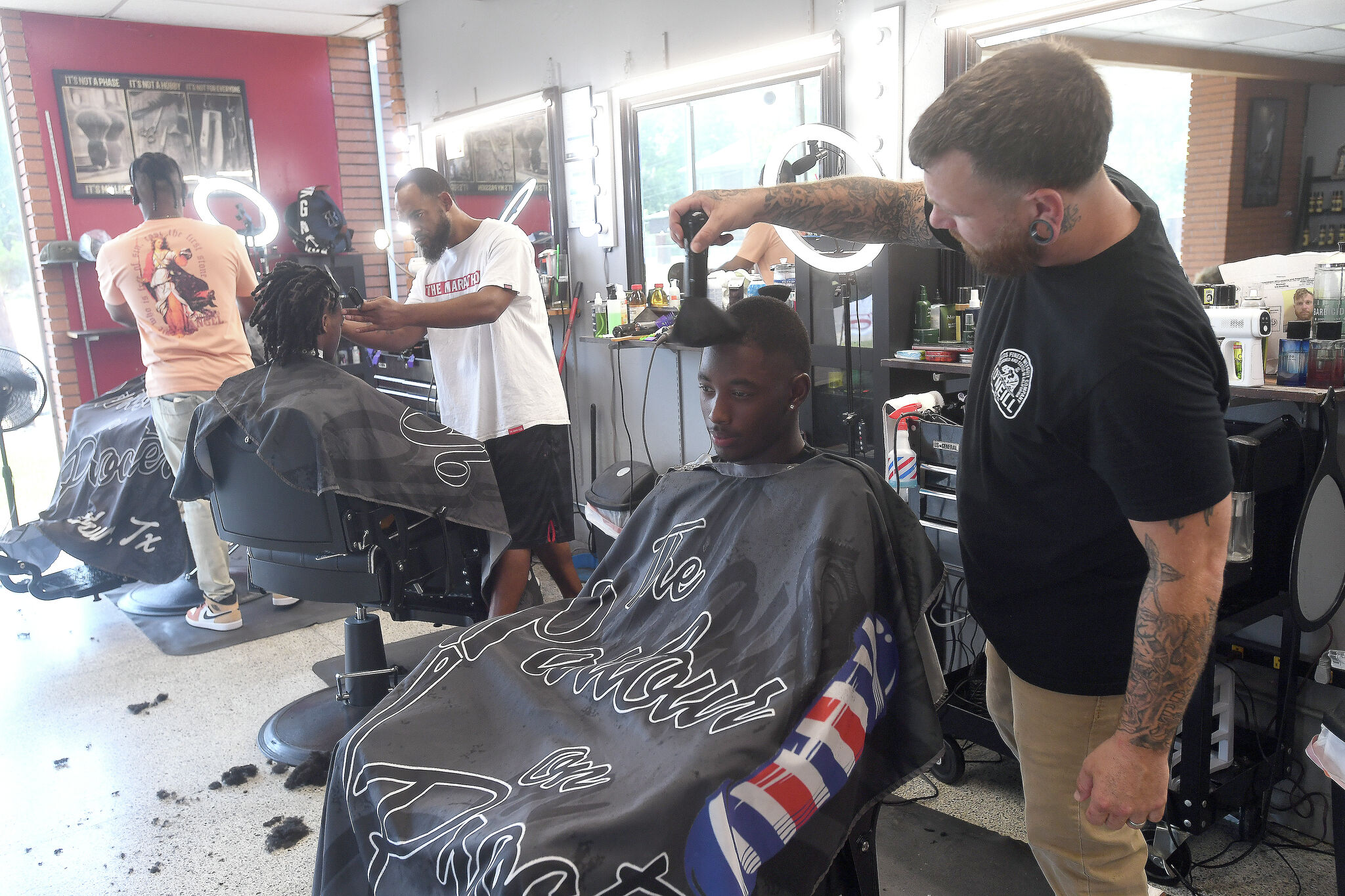 Port Arthur barber joins non profit for annual school haircuts event