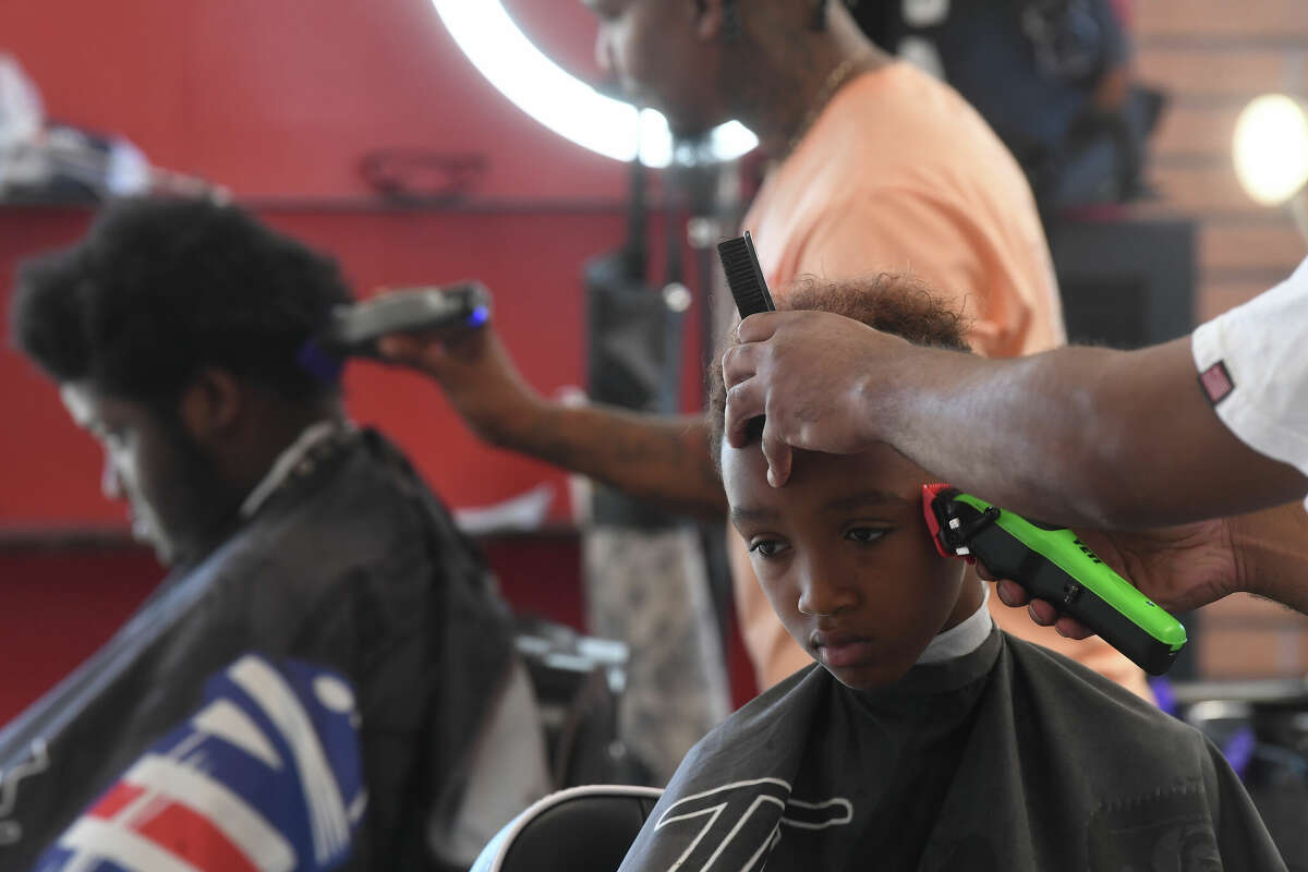 Port Arthur barber joins nonprofit for annual school haircuts event