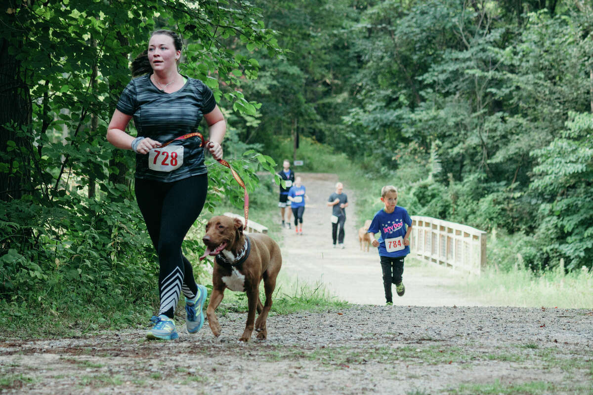 Participants in an earlier Dirty Dog Trail Run in Midland City Forest. Saturday, Aug. 19 marks the 14th annual run.