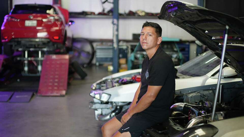 Rudy Martínez sits in his shop, Texas Tires & Parts, located across the street from Living Earth on Crawford Road on Wednesday, Aug. 16, 2023 in Houston. The landscape supply facility caught on fire Monday, August 14, 2024.