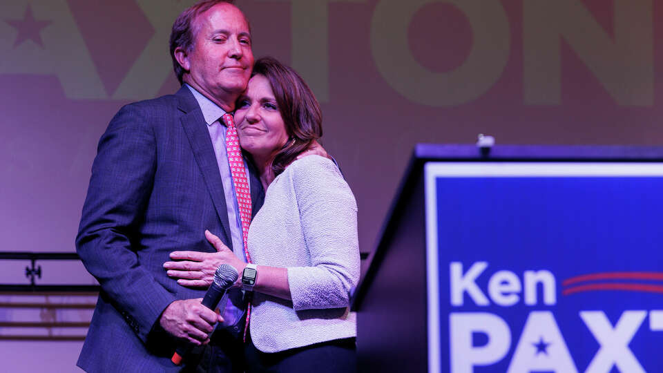 Attorney General Ken Paxton embraces his wife Sen. Angela Paxton before addressing his supporters during his election night watch party at Wilco Work Space in Cedar Park, Texas, Tuesday, May 24, 2022.