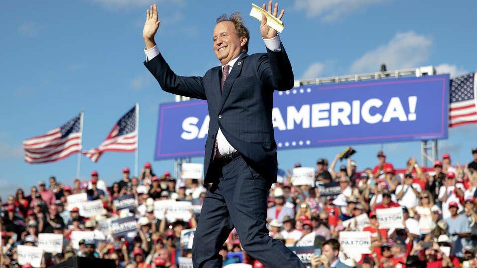 Texas Attorney General Ken Paxton waves to the crowd during a rally featuring former President Donald Trump on Saturday, Oct. 22, 2022, in Robstown, Texas. (AP Photo/Nick Wagner)