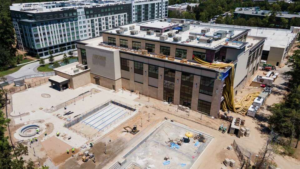 Construction continues on Life Time Fitness' new, 170,000-square foot athletic country club, Thursday, Aug. 17, 2023, in The Woodlands. Scheduled to be completed by late 2023, the chain's largest Texas location, will include a gym, studios, a resort-style pool, restaurant and full service bar, and a kid academy.