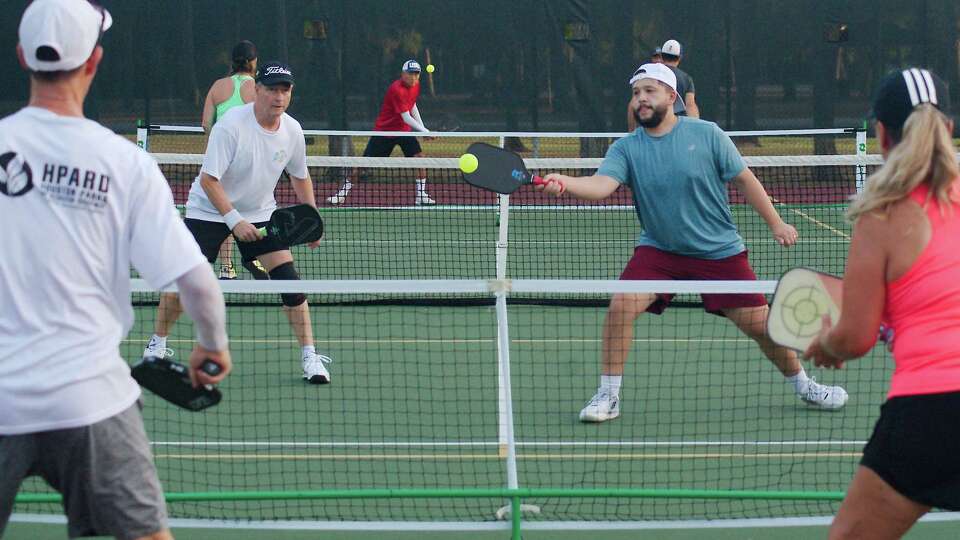 Greater Houston Pickleball members Norman Gilbert, Ron Burton, Alex Valdez and Shay Alhalaby participate in a match during Friday morning play at Frankie Carter Randolph Park, Friday, Aug. 18, 2023 in Friendswood.