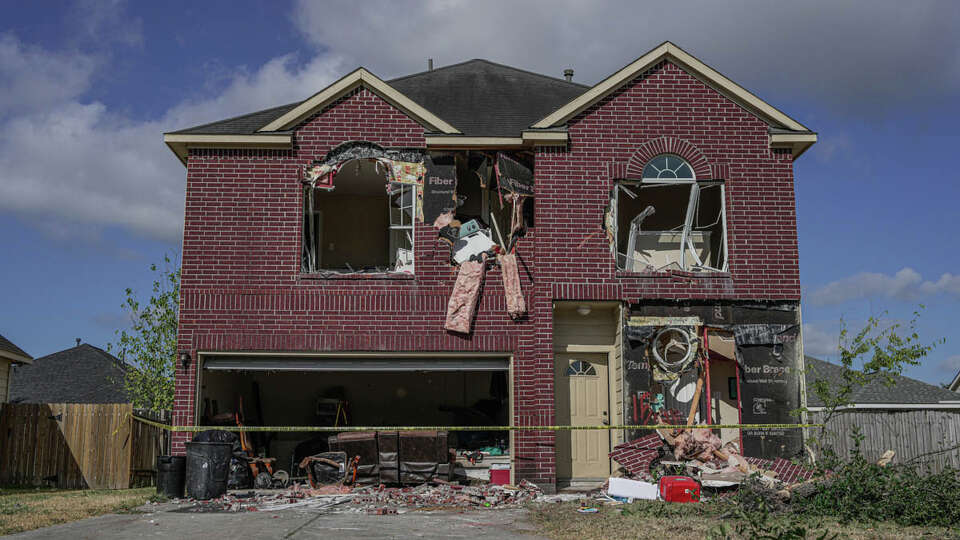 A home in the 11500 block of Silhouette Ridge in northeast Harris County is seen torn apart after law enforcement used The Rook, a bulldozerlike machine with an extendable arm, to rip away an exterior wall and create an opening, in order to get to Terran Green, 34, who barricaded himself in the home on Friday, Aug. 18, 2023, in Houston.