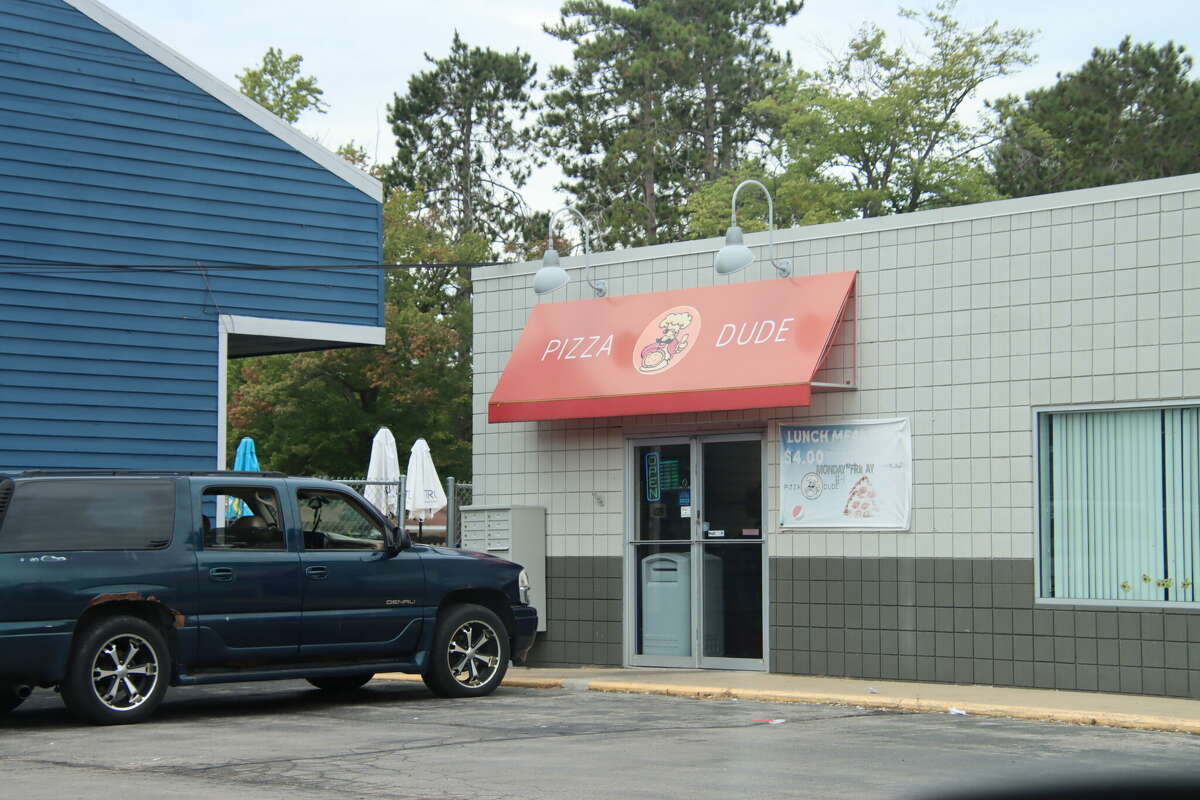 On the job Max Milne puts together his first pizza with Pizza Dude