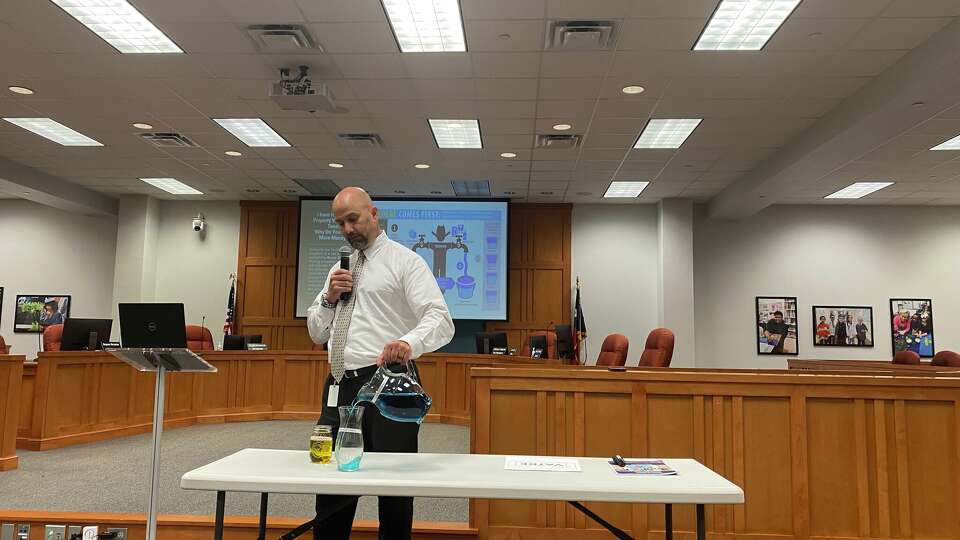 Pearland Superintendent Larry Berger presents a proposed voter-elected tax rate election to district residents at a community meeting on Aug. 17.