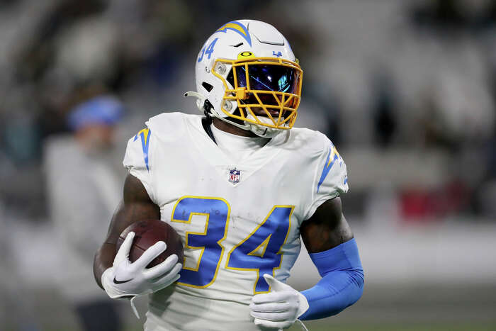 August 19, 2023: Miami Dolphins running back Salvon Ahmed (26) carries the  ball as Houston Texans safety Jimmie Ward (1) looks on after missing a  tackle during an NFL preseason game between