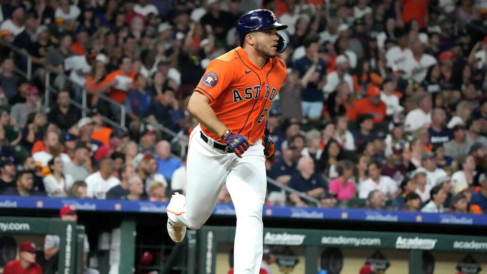 Houston Astros designated hitter Yainer Diaz (21) watches his ball fly out to Cincinnati Reds center fielder TJ Friedl during the sixth inning of an MLB baseball game at Minute Maid Park on Friday, June 16, 2023 in Houston.