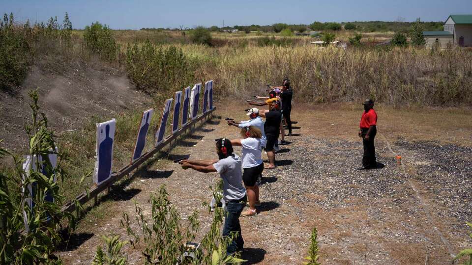 Michael Cargill, owner of Central Texas Gun Works, trains a group during a license-to-carry class at the Lone Star Gun Range in Lockhart on Aug. 5, 2023.