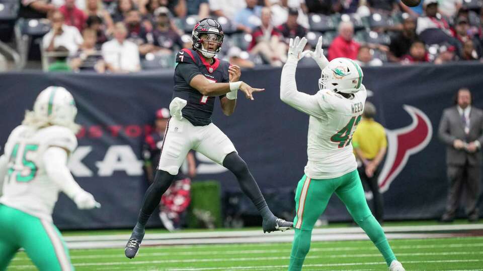 Houston Texans quarterback C.J. Stroud (7) throws a pass over Miami Dolphins linebacker Malik Reed (47) during the first half an NFL preseason football game Saturday, Aug. 19, 2023, in Houston.