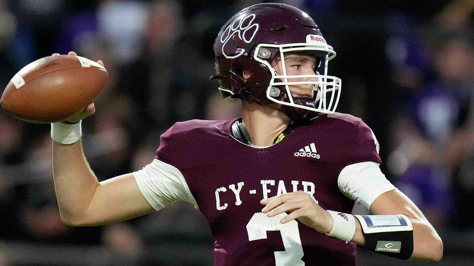 Cy-Fair quarterback Trey Owens throws a pass during the first half of a high school football game against Jersey Village, Friday, Sept. 30, 2022, in Houston.