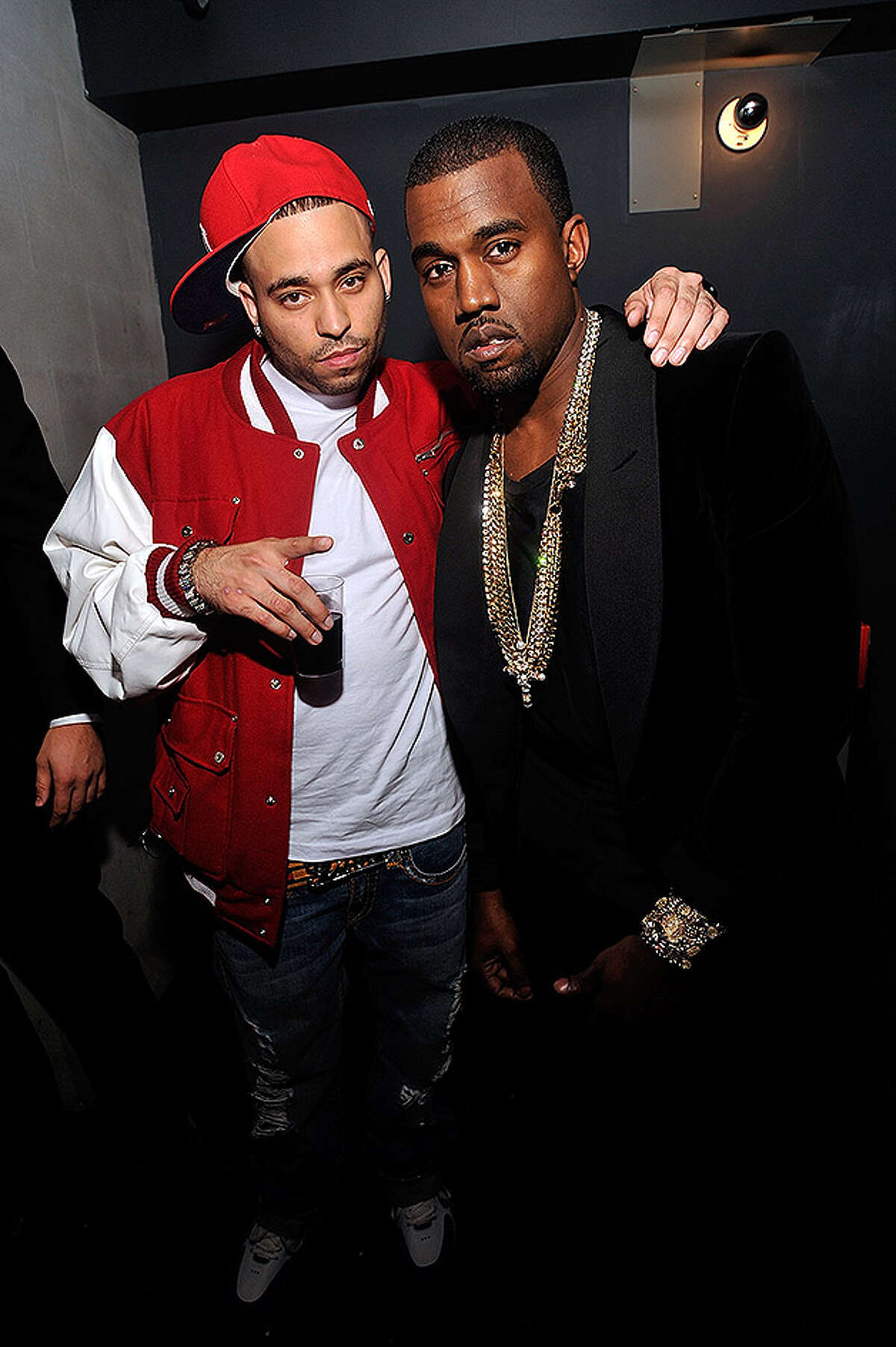 NEW YORK - OCTOBER 21: (R) Recording artist/filmmaker Kanye West poses for a photograph with a moviegoer at the New York Premiere of "Runaway" at Landmark Sunshine Theater on October 21, 2010 in New York City. (Photo by Joe Corrigan/Getty Images for Universal Music) *** Local Caption *** Kanye West