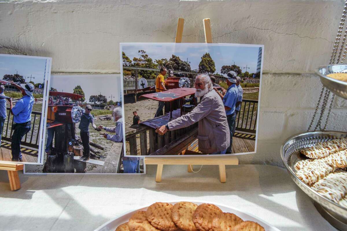 Photos of Tyler James Hoare’s life are displayed at Compound Gallery in Emeryville during the memorial service.