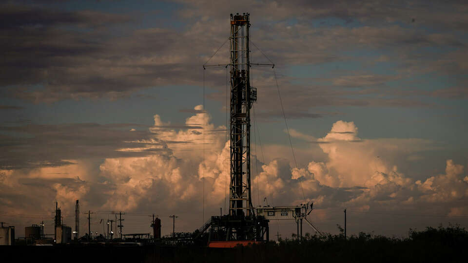 A drilling rig operates as the sun sets Wednesday, July 6, 2022, in Pecos.