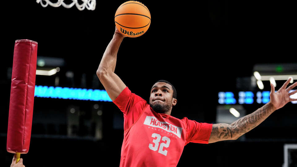 Houston forward Reggie Chaney (32) goes to the basket during a drill at a practice ahead of the first round of the NCAA Men's Basketball Tournament on Wednesday, March 15, 2023, in Birmingham, Ala. Top-seeded Houston play No. 16 Northern Kentucky in a first-round game to open the tournament.