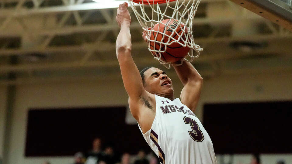 Magnolia West small forward Brandon Taylor (3) dunks the hall during the first half of a District 21-5A boys basketball game at Magnolia West High School on Tuesday, Jan. 3, 2023 in Magnolia.