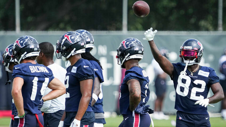 Houston Texans wide receiver Steven Sims (82) tosses a ball between drills during mandatory mini camp on Wednesday, June 14, 2023, at Houston Methodist Training Center in Houston.