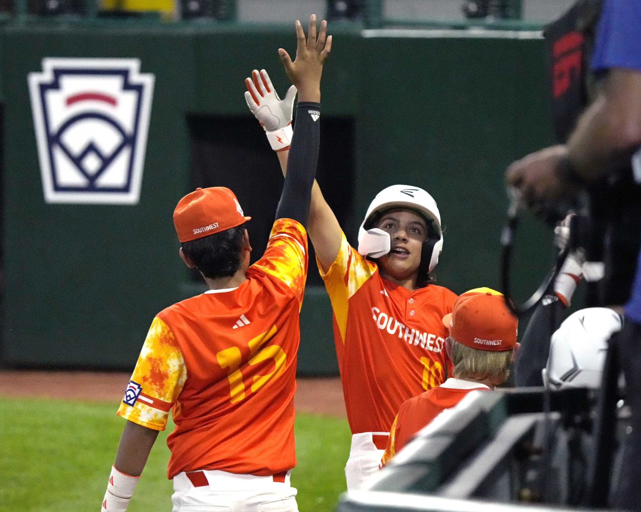 Four Young Little League Baseball Players in Red and White Team