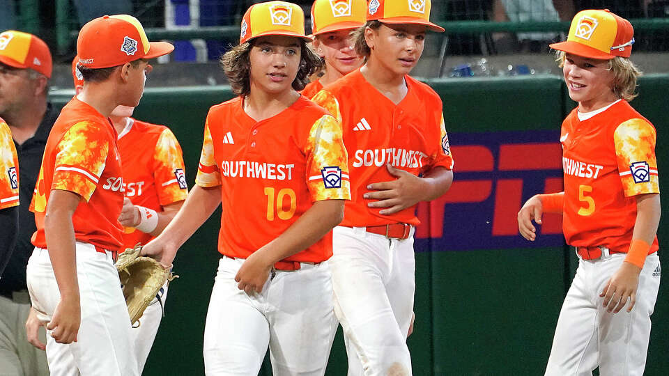 Needville, Texas' DJ Jablonski (10) celebrates with teammates after their win over El Segundo, Calif., in a baseball game at the Little League World Series tournament in South Williamsport, Pa., Monday, Aug. 21, 2023. (AP Photo/Tom E. Puskar)