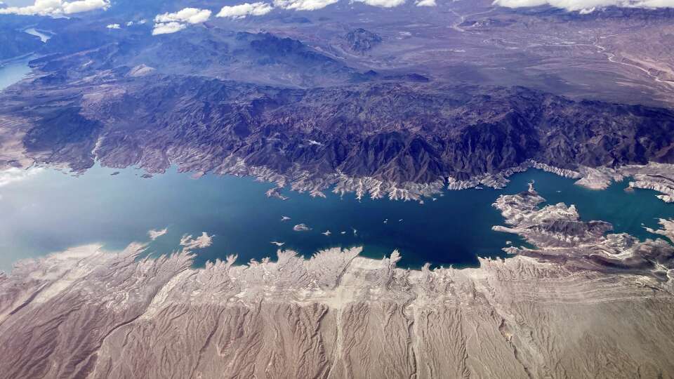 A bathtub ring shows where the water mark on Lake Mead once was along the boarder of Nevada and Arizona, March 6, 2023, near Boulder City, Nev. (AP Photo/John Locher)