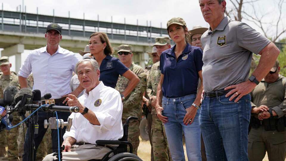 Texas Gov. Greg Abbott, center, is joined by Oklahoma Gov. Kevin Stitt, left, Iowa Gov. Kim Reynolds, second from left, South Dakota Gov. Kristi Noem, second from right, and Nebraska Gov. Jim Pollen, right, during a news conference along the Rio Grande, Monday, Aug. 21, 2023, in Eagle Pass, Texas.