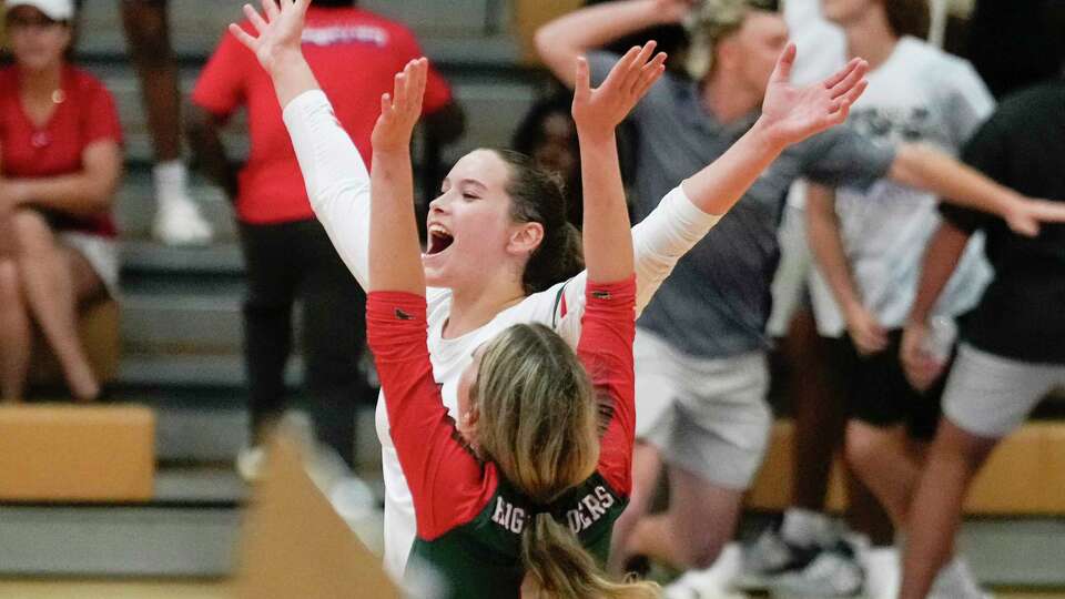 The Woodlands' Ella Lewis (14) reacts after scoring the match-winning point against Oak Ridge during a District 13-6A high school volleyball match at Oak Ridge High School, Tuesday, Aug. 22, 2023, in Oak Ridge North.