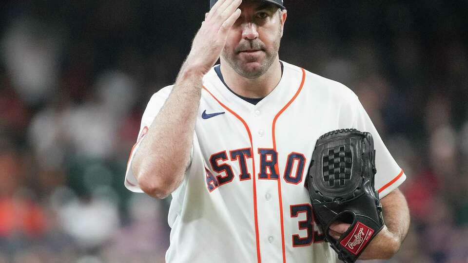 Houston Astros starting pitcher Justin Verlander (35) salutes home plate umpire Pat Hoberg before the Houston Astros host the Boston Red Sox at Minute Maid Park on Tuesday, Aug. 22, 2023 in Houston. Houston Astros won the game 7-3.