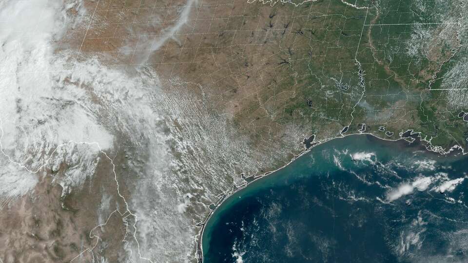 Remnants of Tropical Storm Harold, at left, press westward on Wednesday, leaving Southeast Texas under sunnier skies and less cloud cover.